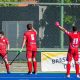 Jogadores do Germânia comemorando um gol no Brasileiro de hóquei sobre a grama